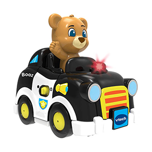 Zwart/witte speelgoedauto met een beertje achter het stuur