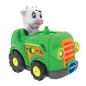 Groene speelgoedauto met een koe achter het stuur